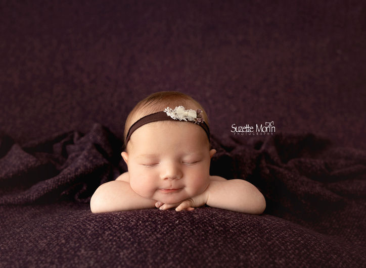 newborn session using a plum color backdrop