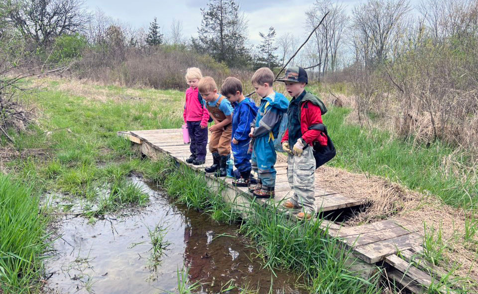 Children fishing of a boardwalk