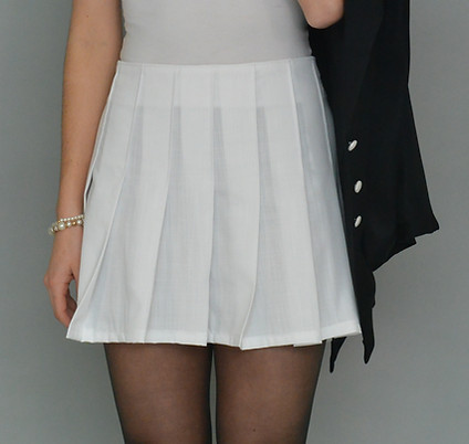 close-up of knife-pleated skirt