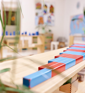 Light class in Montessori kindergarten. The colorful numeric rods in the foreground. nobod