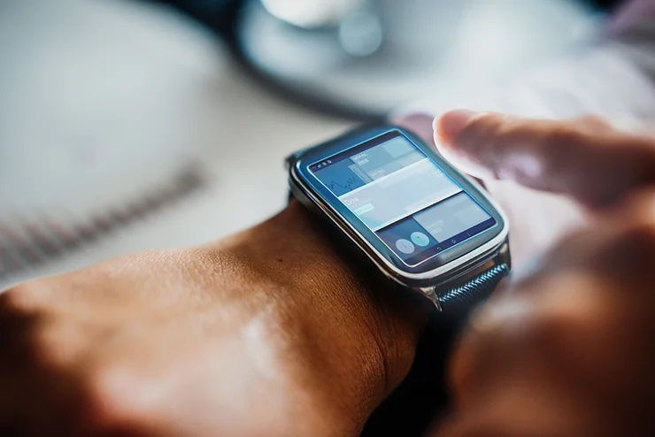 person using smart watch to collect RWE
