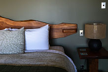 nikau room bed and local artist side table and bedhead_edited.jpg