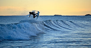 surfer catching a wave nine mile beach West Coast
