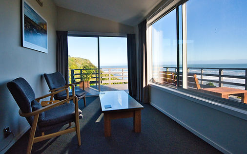 11 Kowhai room sitting area with balcony and views to sea_edited.jpg