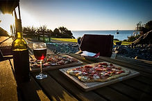 Freshly cooked gourmet pizza served at Breakers Boutique Accommodation near Greymouth and