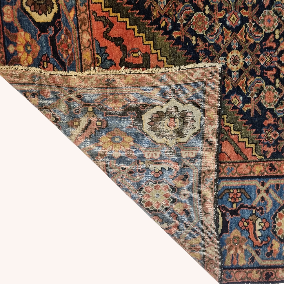 Vintage Persian Malayer rug with herati pattern, terracotta and blue palette, showing age to edges and fringes.