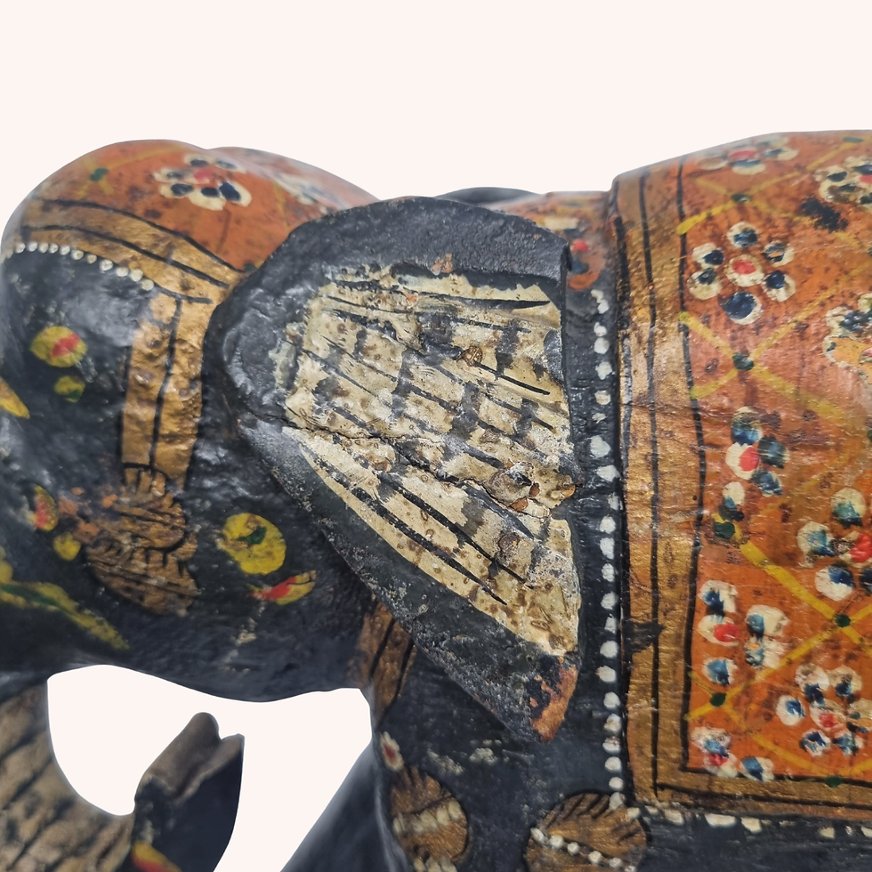 Thumbnail: Hand-painted wooden elephant figure with black finish, colourful saddle detail and decorative accents.