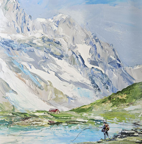 Pêcheur au bord d'un magnifique lac de montagne