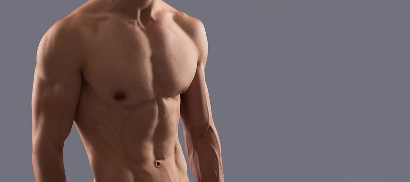 fit-athletic-guy-with-muscular-torso-sports-shorts-grey-background-man-man-sexy-bare-torso