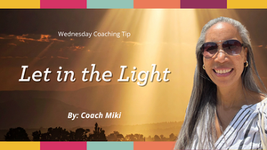 Smiling woman in sunglasses under sunrays