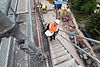 construction-worker-with-plans-ascends-scaffolding-2026-03-09-06-07-58-utc.jpg