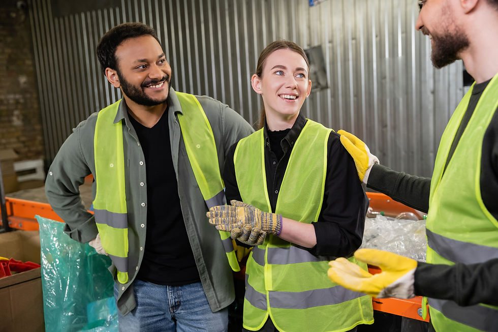 workers-smiling-in-recycling-center-wearing-safety-2026-01-09-12-22-08-utc.jpg