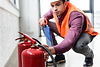 inspector-checking-fire-extinguishers-for-safety-c-2026-03-13-01-09-33-utc.jpg
