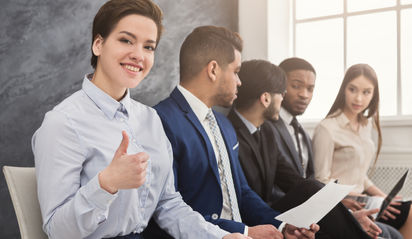 Canva - Multiracial people waiting in qu