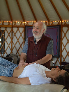 Gilles doing CNT in yurt smile.JPG