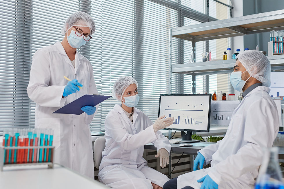 group-doctors-masks-gloves-discussing-epidemic-with-each-other-while-working-with-analysis