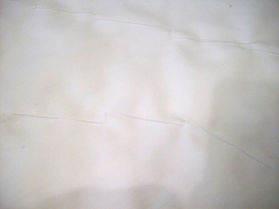 The hand stitches that attach the lace.