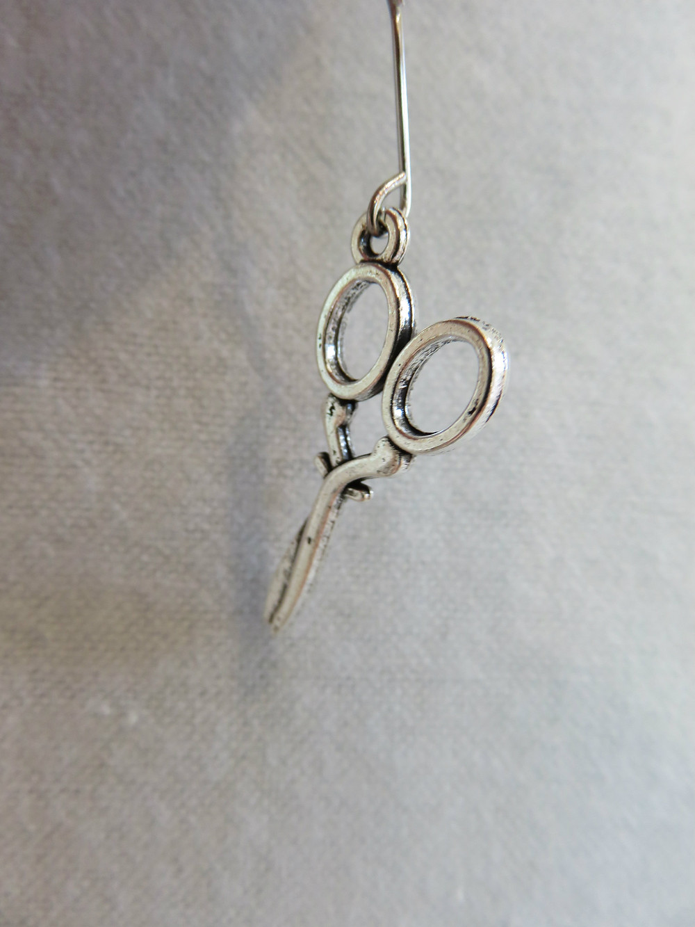 Charm on eye pin