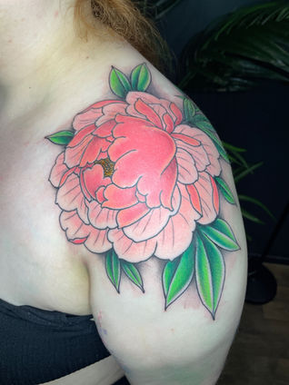 Colour neo traditional tattoo of a peony on a shoulder