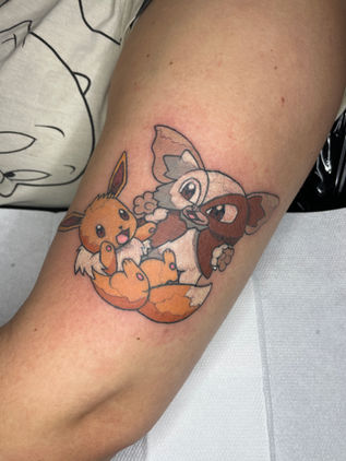 Colour Pokemon Eevee and Gizmo tattoo