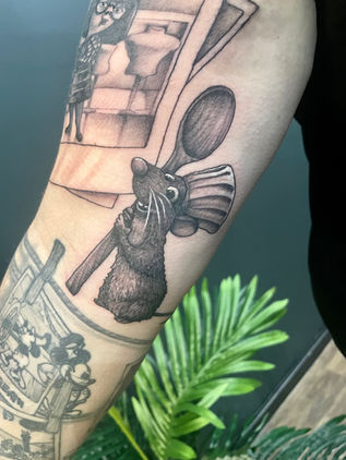 Black and Grey Remy from Pixar Ratatouille tattoo