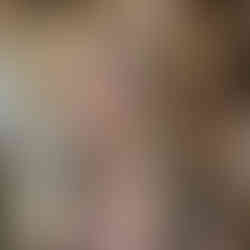 Soft dimensional blonde balayage with blended blonde tones and loose waves, created by a hairstylist at The Grove Salon in Chilliwack.