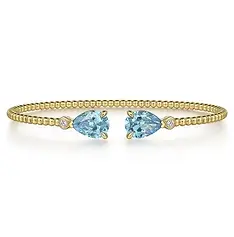 gold bead bangle bracelet with aquamarine stone.webp