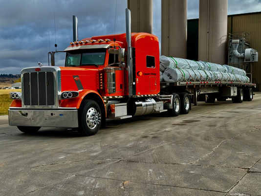 Truck driver at Open Way Inc terminal – CDL drivers wanted for step deck, flatbed, and oversize freight.
