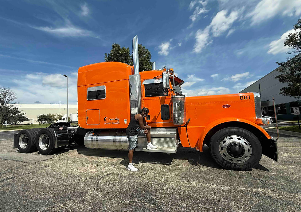 Open Way Inc step deck truck hauling oversized equipment – reliable CDL jobs with safe, trusted trucking company.