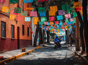 A motorcycle driving down the street during the Day of the Dead in Mexico City