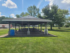 Large park pavilion with picnic tables