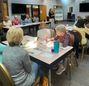 Attendees listen to presentation at Senior Center meeting