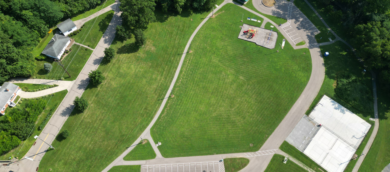 Neighborhood park, aerial view, with playground and courts