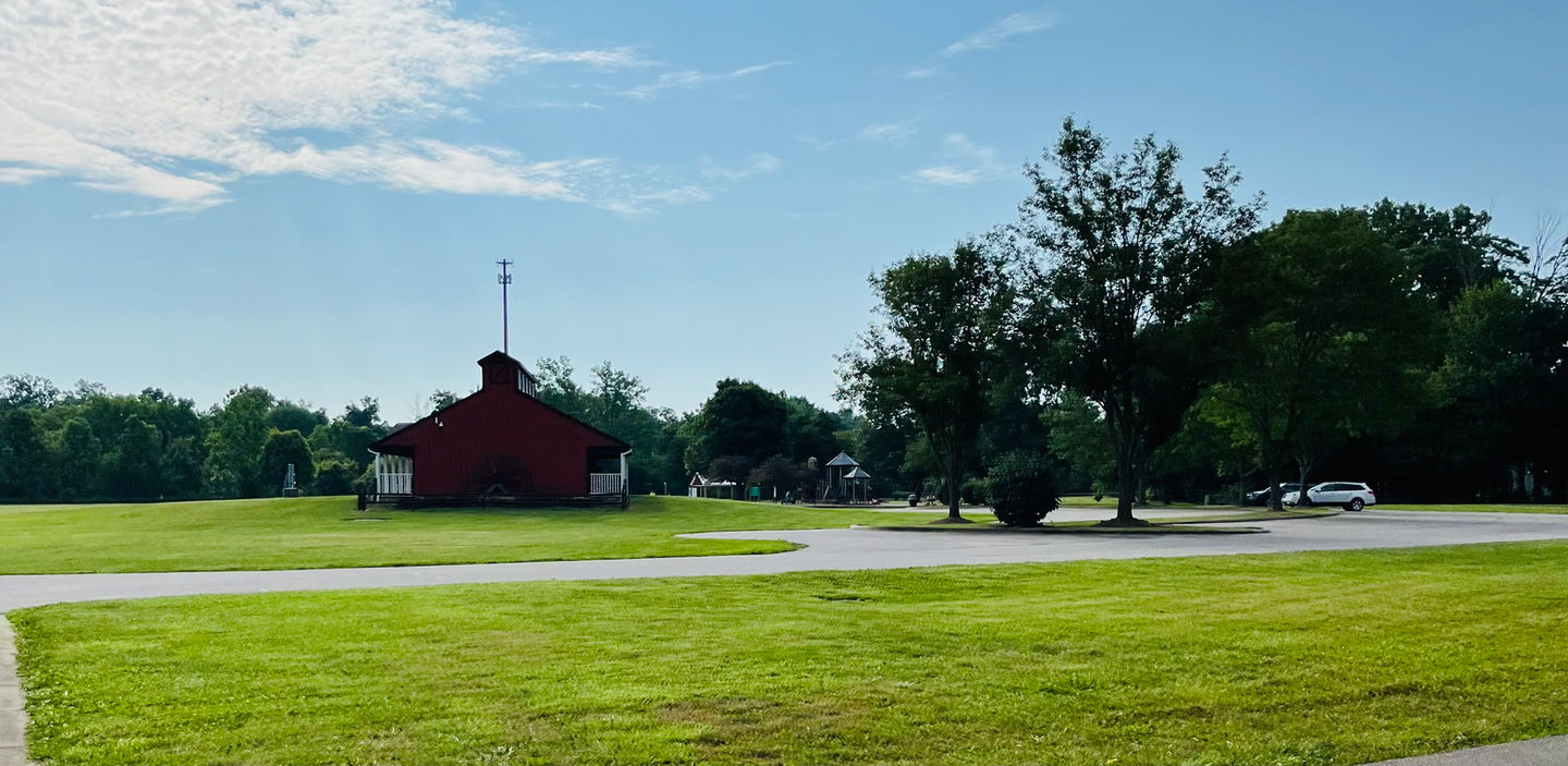 Red barn at park sunny day