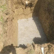 Excavation with gravel base for precast concrete