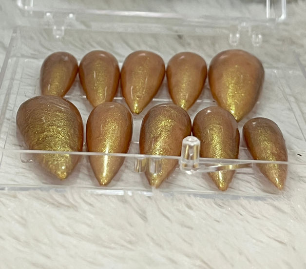 Gold chrome nude press-on nails with glossy finish