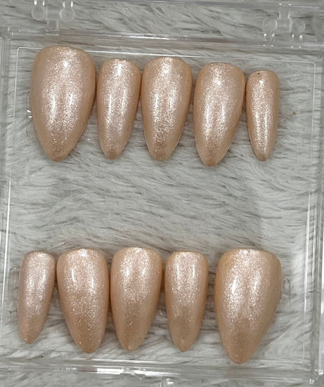 Soft nude press-on nails with luminous shimmer