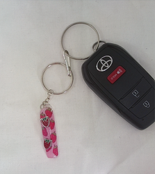 Strawberry Fields 1-of-1 glitter pink strawberry nail keychain by Pressiva