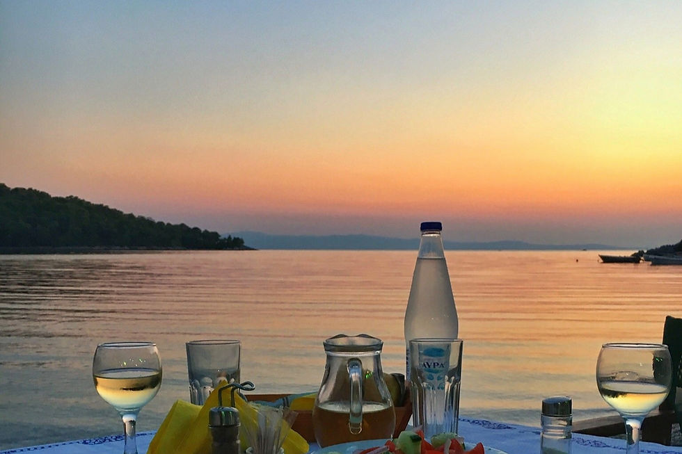 dinner at panormos skopelos with a sunset