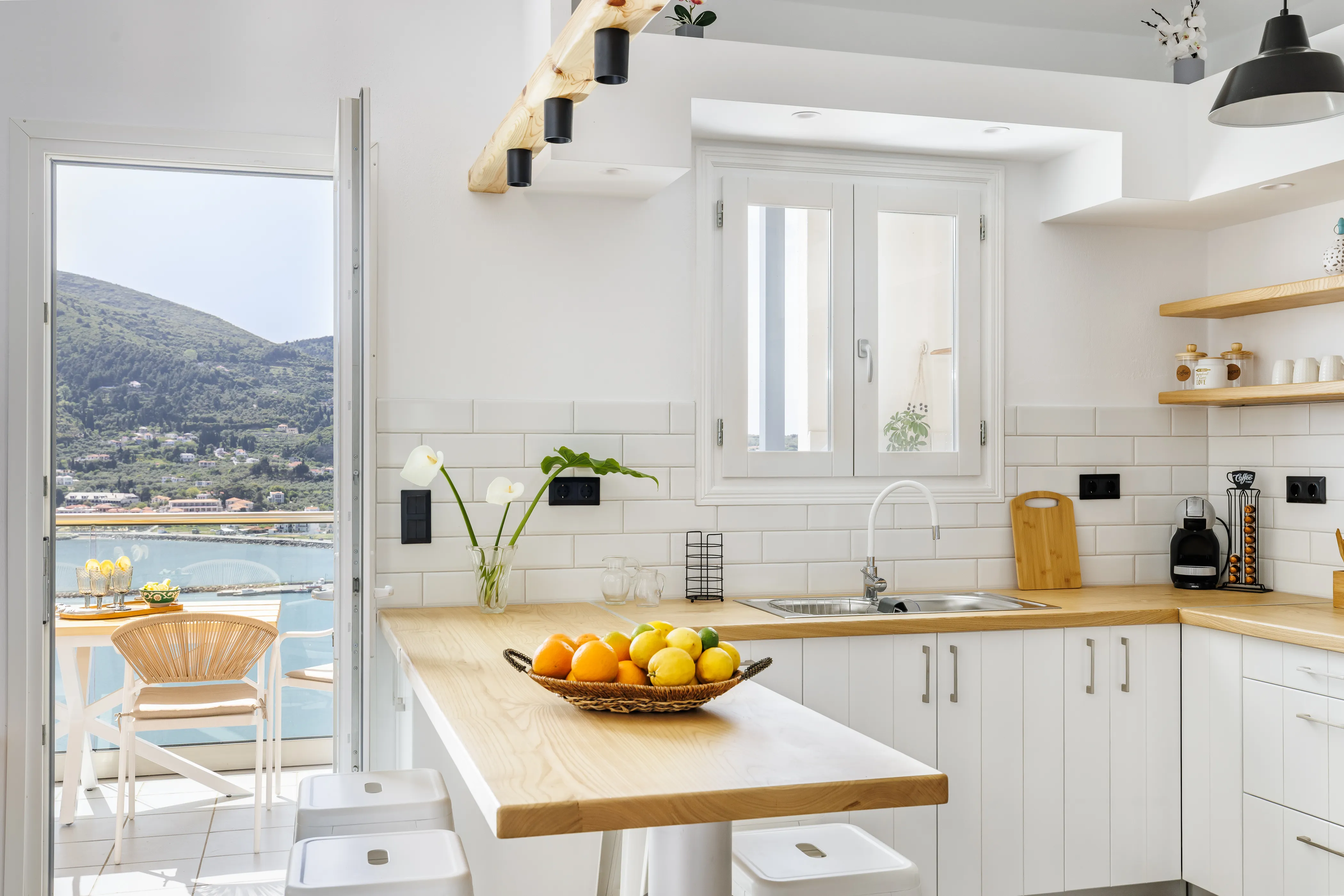 Koukou house modern kitchen with a view of Skopelos Town