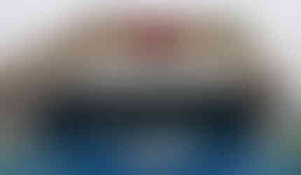 White standing seam metal awning installed on a retail store entrance for shade and curb appeal.