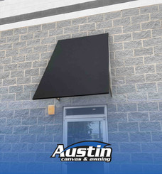 New black awning fabric installed by Austin Canvas & Awning, showcasing a fresh, clean look for BA Hoft in Charlotte, NC.