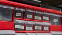 Organized replacement parts inventory for Dell, Lenovo, Acer, and ASUS school devices.