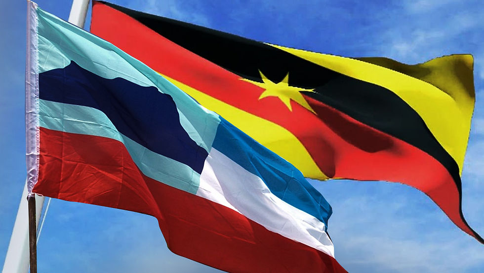 Sabah and Sarawak state flags flying side by side in the air