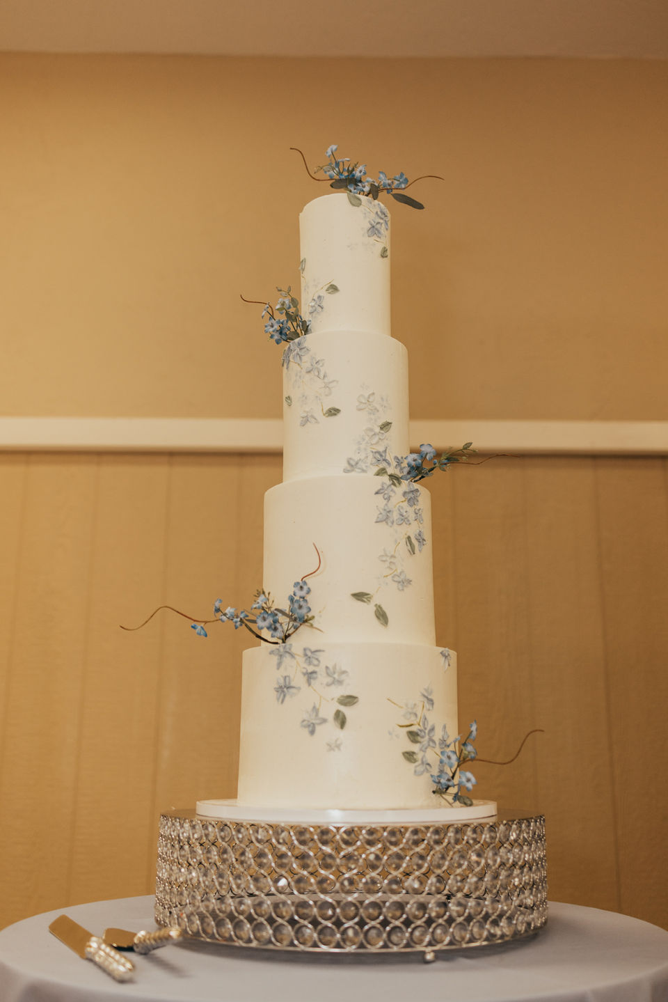 Tall white and dusty blue Wedding Cake