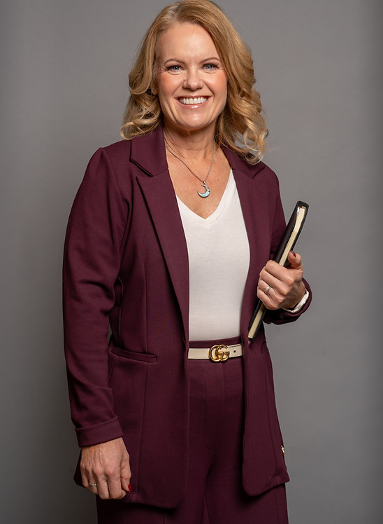 Woman lawyer wearing suit and holding book
