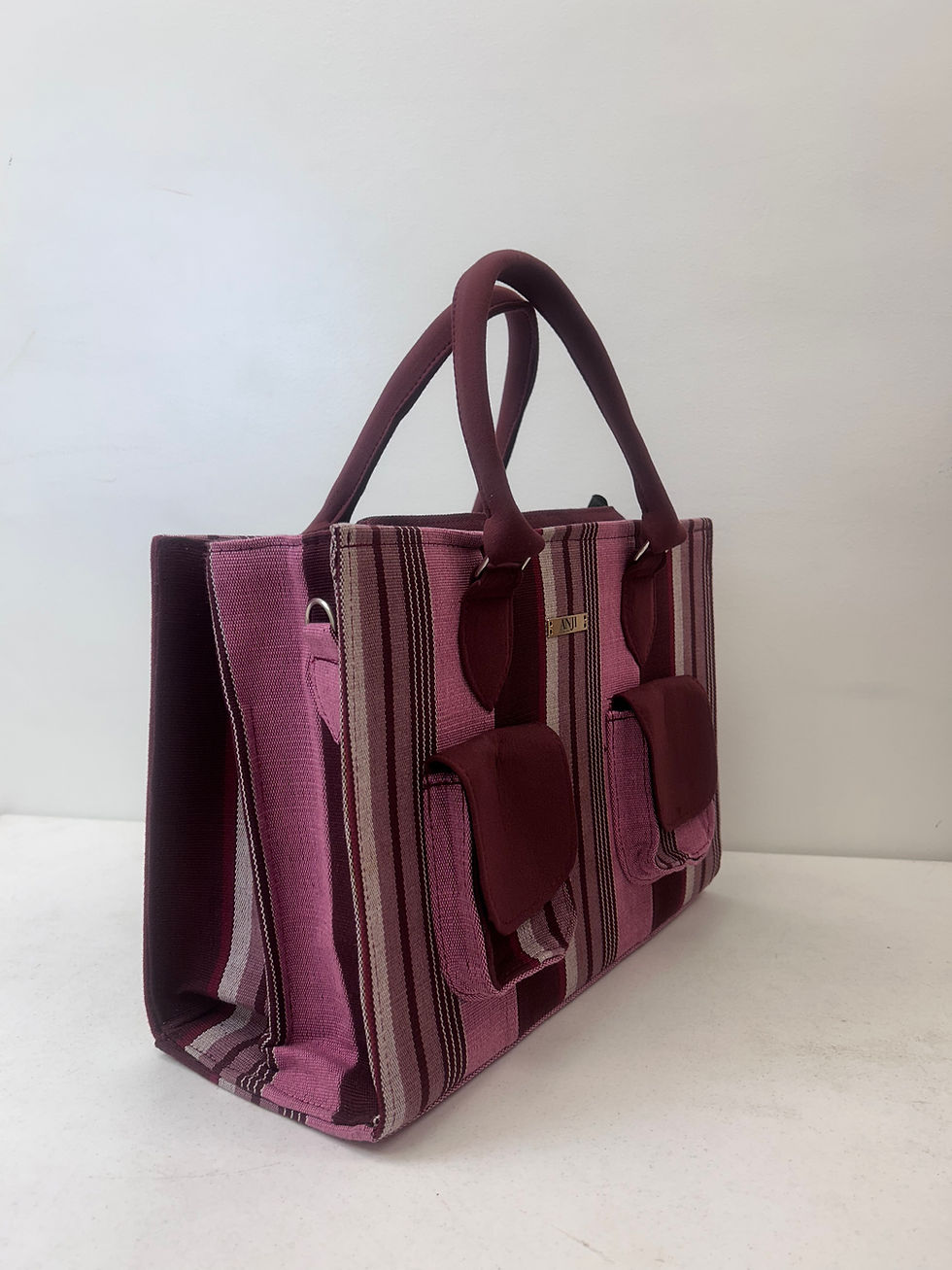 Ìsàlè Èkó Aṣọ òkè Pink Stripe Travel Bag