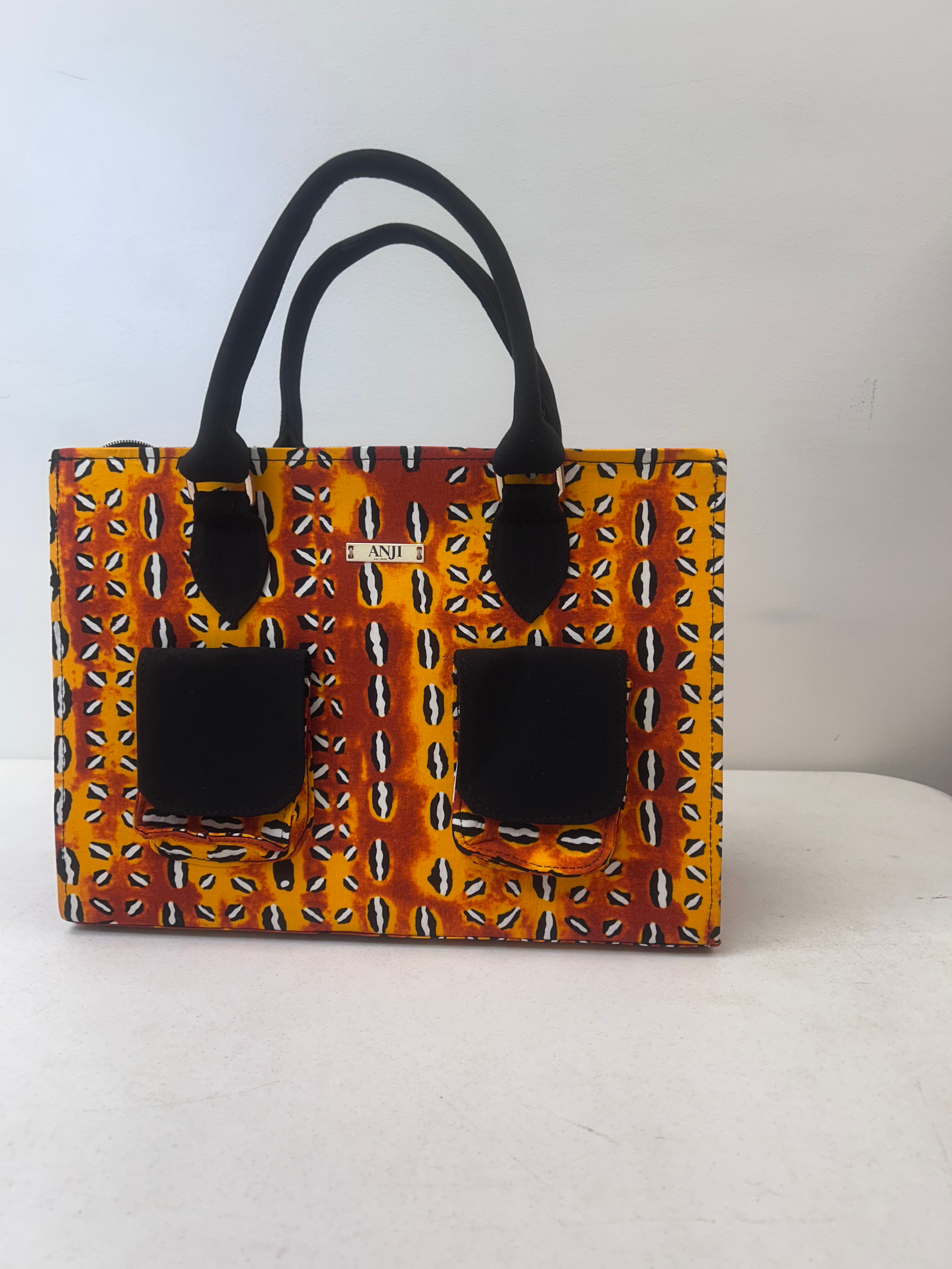 Ìsàlè Èkó Ankara Orange coral Travel Bag