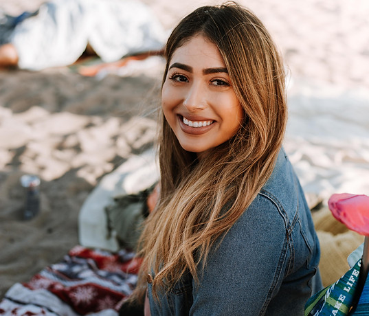 Image of a smiling Latina woman.