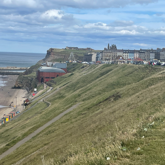 Whitby from the beach with the Abbey in the distance